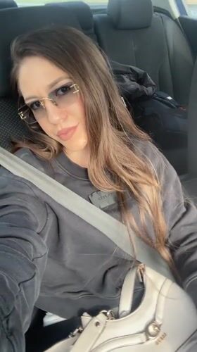 Woman passenger photographed in car in Shishmantsi, Bulgaria