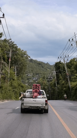 Morning traffic and active construction on a Ko Samui road