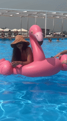 Poolside hangout with inflatable flamingo in Дрокино, Russia