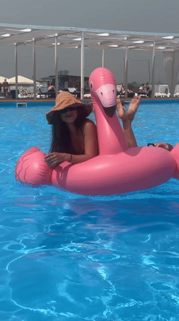 Poolside hangout with inflatable flamingo in Дрокино, Russia