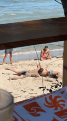 Young men enjoy beach day activities in Tsarevo, Bulgaria