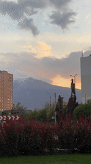 Sofia residents document sunset cityscape with Vitosha Mountain backdrop