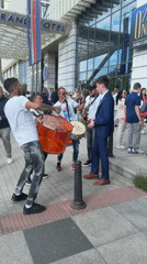 Street musicians perform outside Sofia hotel