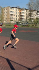 Children exercise on outdoor sports court in Izhevsk
