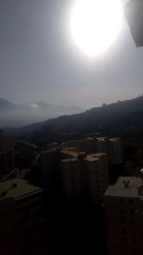 Sunny day captured over Caracas skyline with mountain backdrop