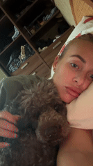 Woman shares quiet morning moment with poodle in Krasnoyarsk