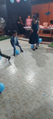 Group plays balloon-stomping game in Arica, Chile