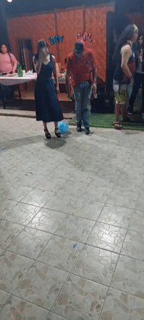 Group plays balloon-stomping game in Arica, Chile