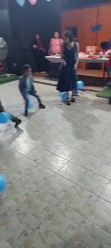 Group plays balloon-stomping game in Arica, Chile