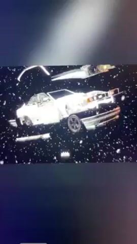The video showcases two BMWs. The first one is an older model, likely from the 1990s, in white with aftermarket black wheels and a lowered suspension. It's snowing, and the car is on a trailer. The video then shows a modern silver BMW on the same trailer in snowy conditions. Finally, it displays the engine bay of the older BMW, showing the engine covered in snow. The video seems to be comparing the older and newer BMW models.