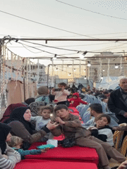 Community gathering with families held in Gaza City displacement camp