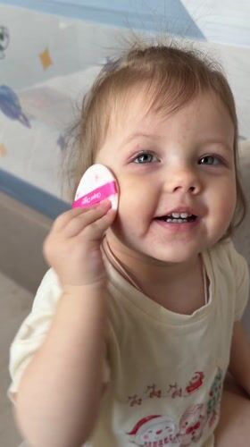 Woman's morning skincare routine with toddler in Reshetnikovo