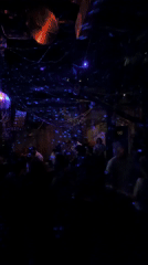 Nightlife scene captured at Paris bar with dancing, bubbles