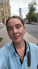 Woman photographs herself on Moscow street