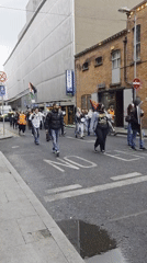 Twenty demonstrators march with Palestinian flag, chanting on street