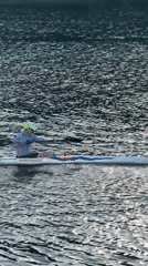 Kayaker spotted on Lyon river in bright afternoon conditions