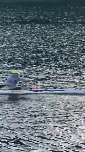 Kayaker spotted on Lyon river in bright afternoon conditions