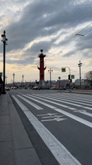 Evening scenes captured around Saint Petersburg's historic Rostral Columns
