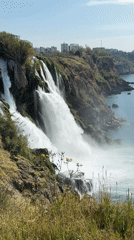 Waterfall flows into sea near Antalya, Turkey coastline