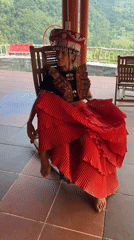 Woman poses in traditional Vietnamese dress in Thông Nguyên Commune