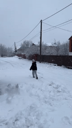 Winter snowfall activities documented in Abinsk, Russia residential area