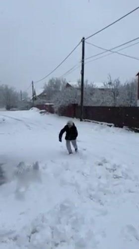 Winter snowfall activities documented in Abinsk, Russia residential area