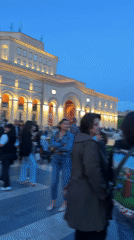 Evening crowds gather in Yerevan's Republic Square with police present