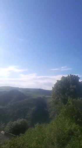 Panoramic video captures lush Armenian hills under clear skies