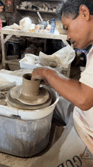 Ceramic artisans work pottery wheels, kilns in Kediri workshop