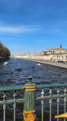 Bridge view captured over Saint Petersburg river amid historic architecture