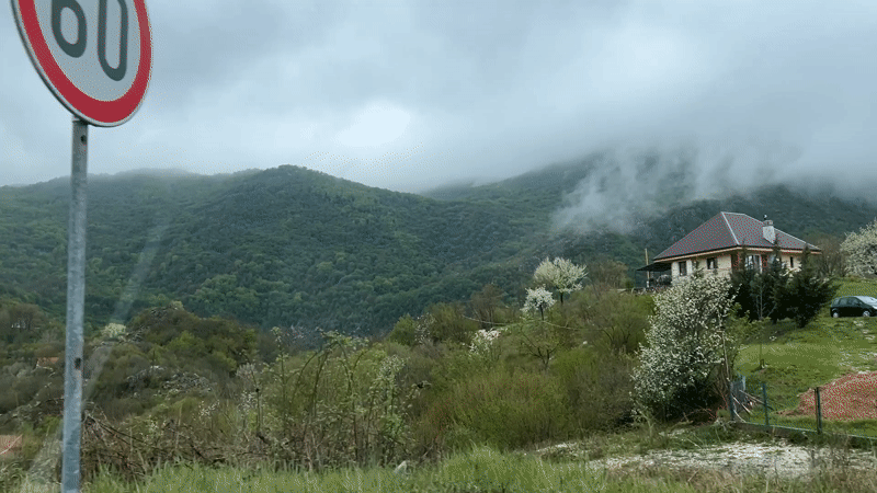 Traveler captures scenic mountain vista from vehicle in Montenegro