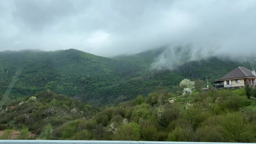 Traveler captures scenic mountain vista from vehicle in Montenegro