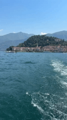 Boat passenger films coastal town view near San Giovanni, Italy