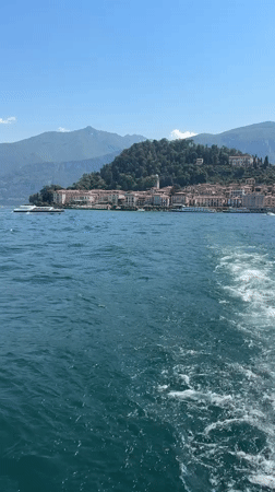 Boat passenger films coastal town view near San Giovanni, Italy