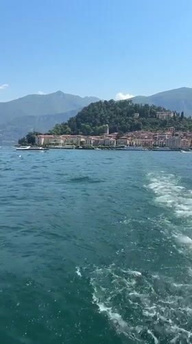 Boat passenger films coastal town view near San Giovanni, Italy