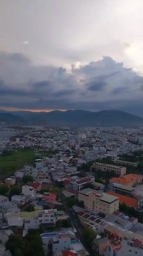Nha Trang at dusk, from rooftops to street level