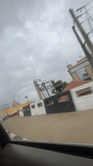 Driver travels through Abuja roads on overcast morning
