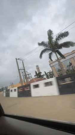 Driver travels through Abuja roads on overcast morning
