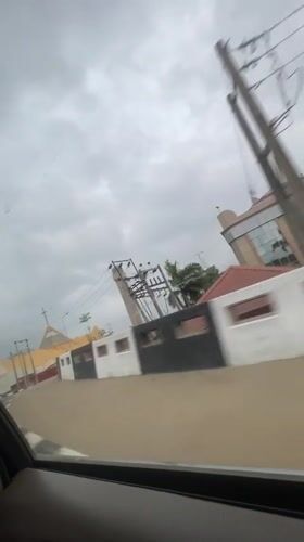 Driver travels through Abuja roads on overcast morning