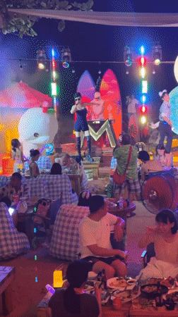 Nighttime outdoor stage show in Jiyang District, dog in tow