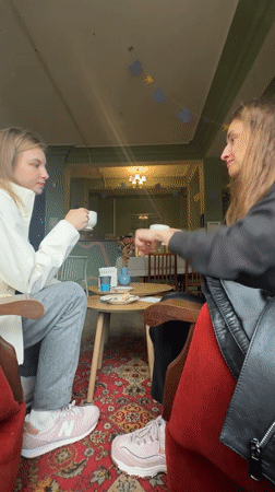 Two women share coffee and toast at Kryvyi Rih cafe