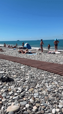 Summer beach day in Sochi: sun, parasails, and Black Sea vibes