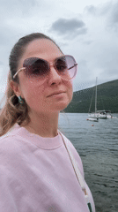 Woman enjoys cloudy morning by Montenegro coast amid local scenery