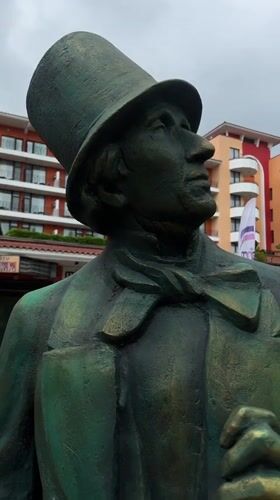 Morning scenes from Nesebar: cats, statues, wet courts