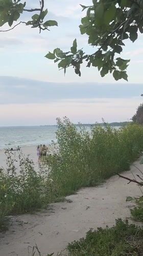 Evening stroll on a calm Baltic beach in Kulikovo
