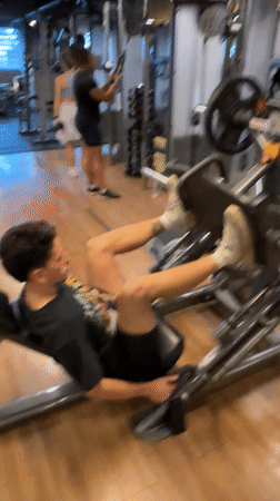 Man exercises at São Paulo gym during evening workout session