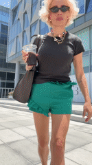 Woman documents morning walk through modern Dubai district