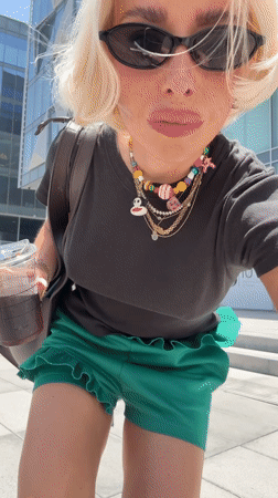 Woman documents morning walk through modern Dubai district