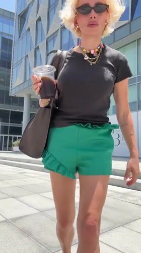Woman documents morning walk through modern Dubai district