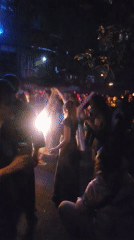 Nighttime outdoor concert draws crowds in Moscow urban courtyard